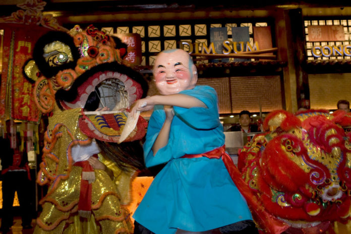 An opening ceremony held for the opening of a new food court at Mohegan Sun's Sunrise Square featured a traditional Chinese Lion Dance. / An opening ceremony held for the opening of a new food court at Mohegan Sun's Sunrise Square featured a traditional Chinese Lion Dance. /