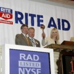 RITE AID CEO Mary Sammons, center, rings the closing bell at the New York Stock Exchange on June 19. Joining her are Karen Rugen, Kevin Twomey and NYSE Euronext president and co-COO Duncan Niederauer. / 