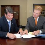 Commercial credit still OK in R.I. JOHN REGAN, right, senior VP for commercial lending at The Washington Trust Co., says the bank is increasing its committment to commercial lending. At left is Richard G. Dunn, VP of commercial lending at the bank. /