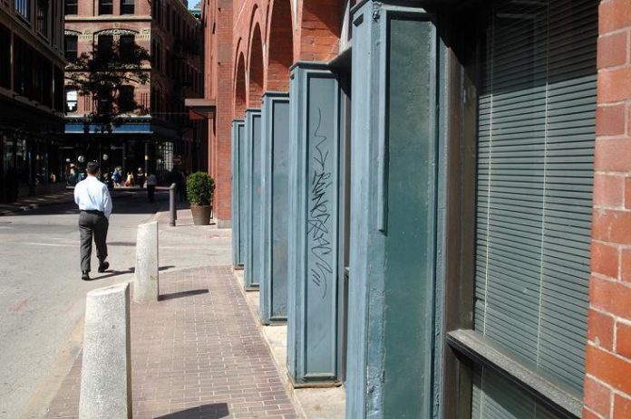 GRAFFITI is a problem even in high-traffic, well-guarded areas of the downtown, such as Eddy Street, above. / GRAFFITI is a problem even in high-traffic, well-guarded areas of the downtown, such as Eddy Street, above. /