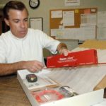 GARY DUTRA packs an order at AVTECH Software, which already has 30,000 customers in 104 countries, plus Antarctica. / 
