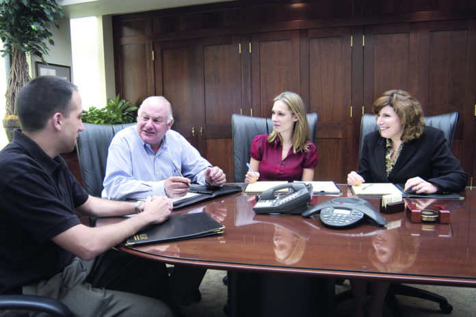KLR TREATS its employees with as much care as its clients. Above, from left, are Anthony Mangiarelli, Lawrence Kahn, Sarah Hann and Margaret Robicheau. / KLR TREATS its employees with as much care as its clients. Above, from left, are Anthony Mangiarelli, Lawrence Kahn, Sarah Hann and Margaret Robicheau. /
