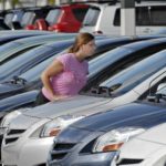 New durable goods orders fall 4.9% in August NEW ORDERS for cars and auto parts fell 8.6 percent in August, while private airplane orders fell 40 percent. Above, shopper Erin Radebaugh examines the offerings at Palm Beach Toyota in Florida last month. /