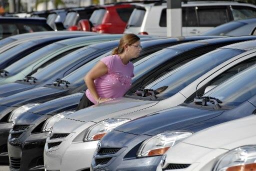 NEW ORDERS for cars and auto parts fell 8.6 percent in August, while private airplane orders fell 40 percent. Above, shopper Erin Radebaugh examines the offerings at Palm Beach Toyota in Florida last month. / NEW ORDERS for cars and auto parts fell 8.6 percent in August, while private airplane orders fell 40 percent. Above, shopper Erin Radebaugh examines the offerings at Palm Beach Toyota in Florida last month. /