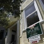 CONDO PRICES in Massachusetts fell 2.9 percent in the third quarter, as sales fell 6.0 percent, The Warren Group said. Above, a sign advertises a unit for sale this summer in the Haight-Ashbury section of San Francisco. / 