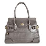 THE ACCESSORIES DIVISION also produces business bags, such as the platinum-tone leather Madison computer tote above, plus date books, card cases, key rings and more. / 