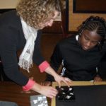Joining forces to promote service A RISD STUDENT works with a Hope High School Arts Community student in one of many community service and outreach projects supported by the Campus Compact. /