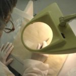 A TECHNICIAN examines one of the textiles that Biomedical Structures creates for use within the human body. / 