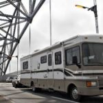 AAA: R.I. gasoline prices rise 4¢ to $3.079 38.7 MILLION Americans, 1.5% more than last year, will travel at least 50 miles this holiday week, and about 80% of them will go by automobile, AAA said. Above, a recreational vehicle crosses a bridge over the Cape Cod Canal during Thanksgiving weekend last year. /