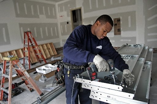 THE HOUSING MARKET INDEX is unchanged this month at a record low of 19 points, the NAHB said. Above, George Powell works on a garage door at a Toll Bros. home at Brier Creek Country Club, in Raleigh, N.C. / THE HOUSING MARKET INDEX is unchanged this month at a record low of 19 points, the NAHB said. Above, George Powell works on a garage door at a Toll Bros. home at Brier Creek Country Club, in Raleigh, N.C. /