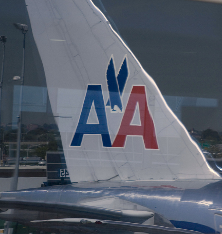 AMERICAN AIRLINES has pared the number of chronically late flights from five to one. Above, a plane at JFK Airport. / 