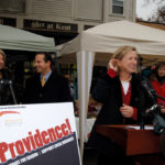 Wendy Brown, right, owner of Wendy Brown Linens, helps Providence Mayor David N. Cicilline, center, kick off the third annual Buy Providence holiday promotion. Joining the festivities at Wayland Square was Greater Providence Chamber of Commerce President Laurie White, left. / 