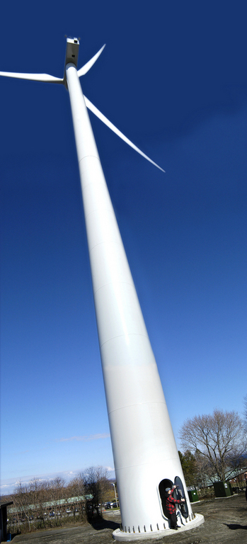 THE WIND TURBINE at Portsmouth Abbey School, designed to supply 40 percent of the school’s energy, went online in March of last year. / THE WIND TURBINE at Portsmouth Abbey School, designed to supply 40 percent of the school’s energy, went online in March of last year. /
