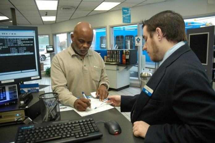ONLY 34 percent of respondents to a recent survey said they purchased insurance when renting a car. Above, Thomas Williams fills out paperwork to rent a car at Thrifty Car Rental in Warwick last week. / ONLY 34 percent of respondents to a recent survey said they purchased insurance when renting a car. Above, Thomas Williams fills out paperwork to rent a car at Thrifty Car Rental in Warwick last week. /