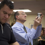 PAUL PALANGE, publisher of the Senior Digest, does almost everything, from reporting and taking photographs, to selling ads, to even making deliveries. Above, he covers a press conference on Meals on Wheels budget cuts. / 