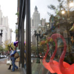 Downtown retail hits its stride BRIGHT FLAMINGOS provide a splash of nonsectarian holiday color in the window of one downcity storefront. /