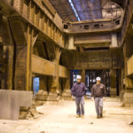Dynamo House plans aim to meet all visitors’ needs KEVIN FERREIRA, senior superintendent for the Dynamo House project, and Bob Lake, a project manager, walk through the building. The steel beams are being demolished. /
