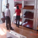 Building supply pipeline that is global, sustainable TOM WINTER, front, principal of North Kingstown-based TP Global Inc., surveys FSC-certified flooring material during a 2006 tour a sustainable material facility in Beijing. /