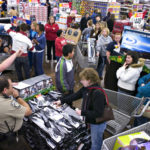Black Friday produces strong holiday shopping NO BUYER’S REMORSE: Shoppers browse merchandise inside a Wal-Mart store in Woodstock, Georgia, on Nov. 23. Retailers nationwide opened early and offered discounts. /
