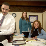 Next generation of entrepreneurs climb ladder FINEES MENDEZ, left, was a founder of RI Marketing & Advertising in 2001. Above, he is pictured with Elisha Hicks, center, the firm’s graphic design director, and General Manager Priscilla Collado. / PBN PHOTO/BRIAN MCDONALD