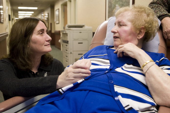 REGISTERED NURSE Colleen MacTavish-Thurber talks with patient Alice Lemos at Grandview Center in Cumberland. Lemos, who was read her last rites shortly before Thanksgiving, has outlived her doctors’ expectations. / 