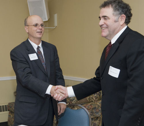 MARK HIGGINS, left, dean of the University of Rhode Island’s College of Business
Administration, and Dennis W. McLeavey of the CFA Institute discuss their partnership. / MARK HIGGINS, left, dean of the University of Rhode Island’s College of Business
Administration, and Dennis W. McLeavey of the CFA Institute discuss their partnership. /