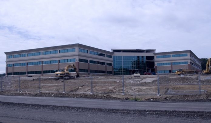 THE BUILDING constructed by the former Brooks Pharmacy to serve as its headquarters, above, is part of the 25-acre parcel purchased from Rite Aid today by New England Institute of Technology. / THE BUILDING constructed by the former Brooks Pharmacy to serve as its headquarters, above, is part of the 25-acre parcel purchased from Rite Aid today by New England Institute of Technology. /