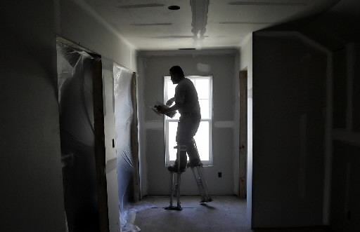 PERMITS for new housing construction plunged last month, as five other leading indicators also worsened, The Conference Board said. Above, Raul Rios wears stilts as he floats joint compound into the drywall seams in a Centex House under construction at Harrington Pointe in Raleigh, N.C. / PERMITS for new housing construction plunged last month, as five other leading indicators also worsened, The Conference Board said. Above, Raul Rios wears stilts as he floats joint compound into the drywall seams in a Centex House under construction at Harrington Pointe in Raleigh, N.C. /