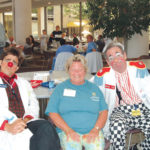CLOWN TIME: Dr. Bounce and Nurse BB helped employee Beverly Freitas reduce stress at a recent Rhode Island Hospital/Hasbro Children&rsquo;s Hospital Stress Less health fair, an event run by Lifespan for its workers. / 