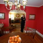 REMOVING YOURSELF: Mary Harirngton, pictured here at a Providence home, helps her customer’s home “stage,” a process that aims to make real estate more attractive to potential buyers, largely by depersonalizing the space. / 