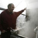 Maple syrup farmer boosts production, cuts oil bill CHARLES CHASE, owner of Charlie's Sugarhouse, recently acquired a heat exchanger, designed to harness and reuse steam, reducing his dependence on heating oil. /
