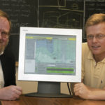 Computer modeling widely used MALCOLM SPAULDING, left, director of the URI Center of Excellence in Undersea Technology, and Eoin Howlett, CEO of Applied Science Associates, with a software
program that models the movement of oil spills. /
