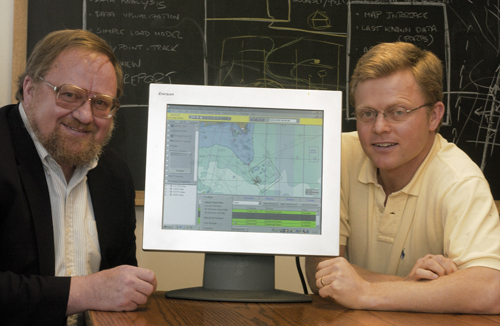 MALCOLM SPAULDING, left, director of the URI Center of Excellence in Undersea Technology, and Eoin Howlett, CEO of Applied Science Associates, with a software
program that models the movement of oil spills. / MALCOLM SPAULDING, left, director of the URI Center of Excellence in Undersea Technology, and Eoin Howlett, CEO of Applied Science Associates, with a software
program that models the movement of oil spills. /