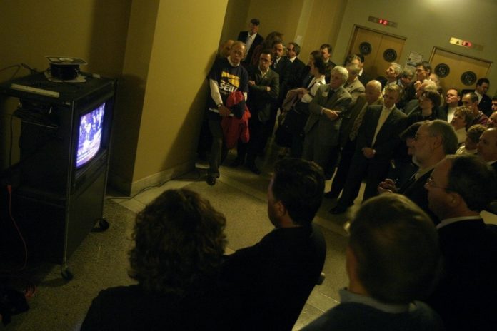 THE OVERFLOW CROWD of concerned taxpayers crowds the hallway outside the basement hearing room to watch the proceedings via closed-circuit TV. / THE OVERFLOW CROWD of concerned taxpayers crowds the hallway outside the basement hearing room to watch the proceedings via closed-circuit TV. /
