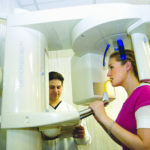 Going ‘green’ can challenge small businesses DR. JOSEPH MATRULLO demonstrates the capabilities of the digital panoramic/celphalometric x-ray machine at Matrullo Cosmetic Dentistry in Cranston. /