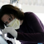 SUE MUSSO, a registered nurse at Rhode Island Hospital, washes an intensive-care unit patient&rsquo;s mouth with chlorhexidine, a 
practice aimed at reducing ventilator-acquired pneumonia. / 