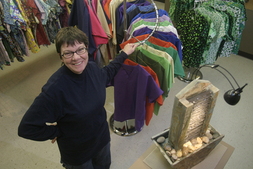 MARGARET HOWARD, owner of TLCare Wear in Warwick, handles the manufacturing of nursing scrubs at her 3-year-old business. / MARGARET HOWARD, owner of TLCare Wear in Warwick, handles the manufacturing of nursing scrubs at her 3-year-old business. /