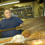 INCREASES IN THE COST of wheat, eggs and transportation are putting the squeeze on bakers such as Arnie Buono, owner of Buono’s bakery in Providence. / 