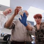 ISIS BIOPOLYMER LEADERS, from left, Michael Jordan, Dr. Miao Young Cao and Emma Durand, examine tissue that was used to test the company’s transdermal patch. / 