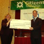 FROM LEFT: Kathy McKenzie, Citizens Bank Group executive vice president of human resources, presents a check of $100,000 to Jim Ryczek, executive director of Rhode Island Coalition for the Homeless. / 