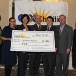 PAUL CRONIN, center, senior vice president and general manager for Cox Communications in New England, and Lt. Gov. Elizabeth Roberts, far right, join representatives of the YMCA of Greater Providence to celebrate their award. / 
