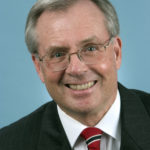 JACK R. WARNER, state commissioner of higher education, says that Rhode Island is working to grow 
college enrollment. / 