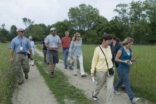 A GROUP WALKS Watson Farm in Jamestown, one of the farms participating in the
University of Rhode Island’s ecological investment project. / A GROUP WALKS Watson Farm in Jamestown, one of the farms participating in the
University of Rhode Island’s ecological investment project. /
