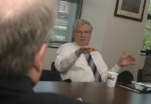 GOV. DONALD L. CARCIERI, shown here during an editorial board meeting with PBN last week, said the state “can’t do much more” to cut human services. / 