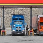 DIESEL PRICES in Rhode Island fell 1 cent to $4.399, in their first weekly decline of the past month, AAA said. Above, truckers fuel their rigs last month at a truck stop in Evenston, Wyo. / 