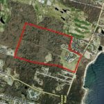 Teaching brotherhood plans 132-unit <br>
mixed-income adult housing development AN AERIAL IMAGE shows the brotherhood property at center, outlined in red, while the Bay is at far right, on the other side of Ocean Road. /