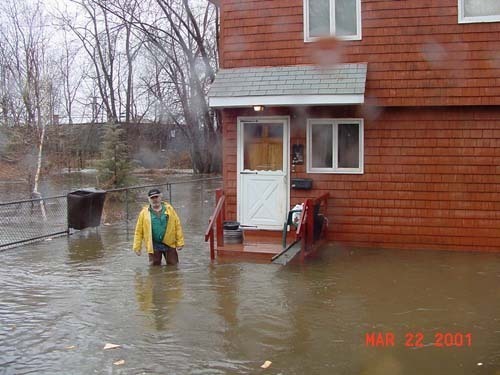 FLOODING LIKE this along the Pocasset River in Johnston, Cranston and Providence has increased in recent decades, damaging homes, businesses, roads and bridges. / FLOODING LIKE this along the Pocasset River in Johnston, Cranston and Providence has increased in recent decades, damaging homes, businesses, roads and bridges. /