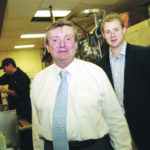 RUSSELL MORIN, foreground, with his son, Michael, right, has expanded his catering business and now employs 240 people. / 