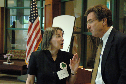 CONNIE MCGREAVY, a consultant with Conserve By Design LLC, speaks with Seth Kurn, vice president of the New England Institute of Technology. / CONNIE MCGREAVY, a consultant with Conserve By Design LLC, speaks with Seth Kurn, vice president of the New England Institute of Technology. /