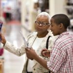 CORE PRICES excluding food and energy costs rose a moderate 0.2% in May, the BLS said. Above, Annette Jackson shops at a Target store with grandchild D'Onte Robinson. / 